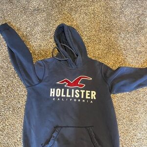 Hollister Dark Blue Sweatshirt with Red Emblem